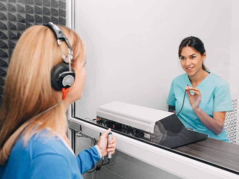 Picture of a woman taking a hearing test